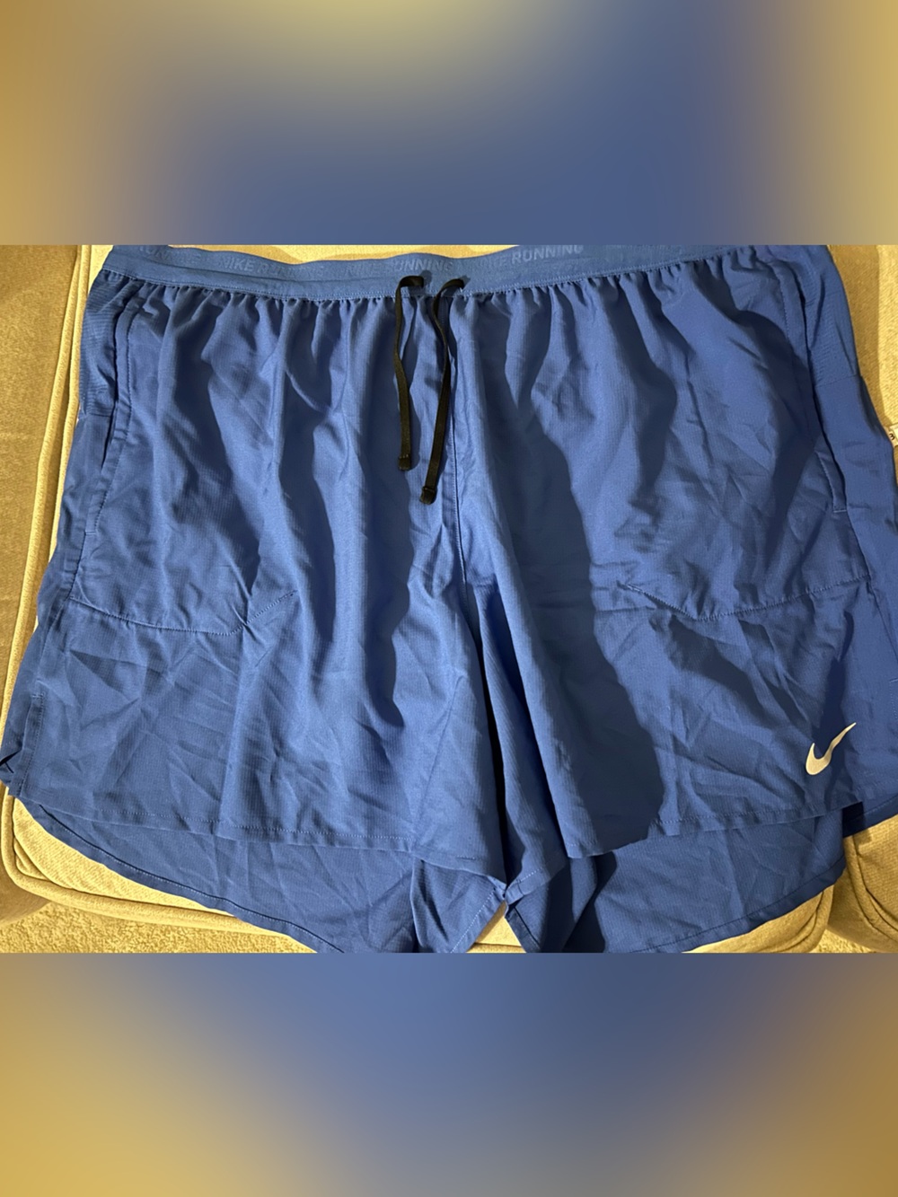 NWT Nike running shorts. Royal blue. 2 front pockets. 1 mid back zip pocket.